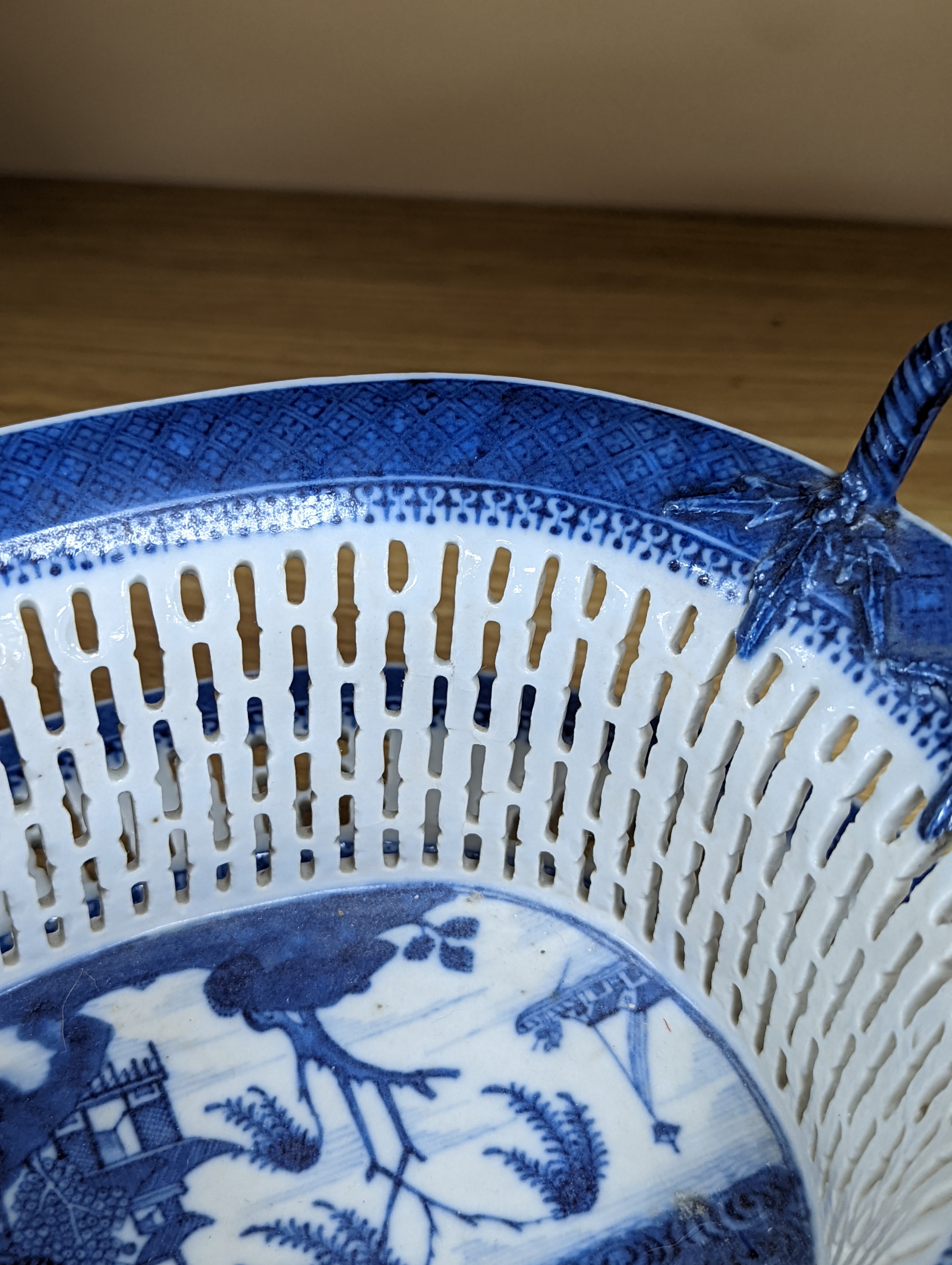 A Chinese blue and white chestnut basket and stand, Qianlong period, basket 11 cms high.